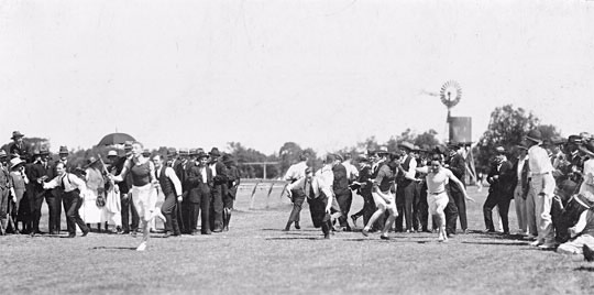 Relay race during the Melbourne office picnic at Aspendale Park, December 1921.