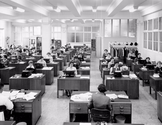 Brisbane branch correspondence section, August 1955. Desks are lined up with military precision with supervisors looking back at their staff, almost like being back at school.