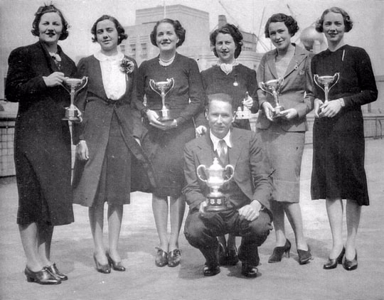 Sydney branch women's tennis team, Premiers of the NSW Public Service Tennis Association, 1938. Left to right: Misses Lang, Bush, Elith, Falvey, Crown and Lake, with Mr Bennett.